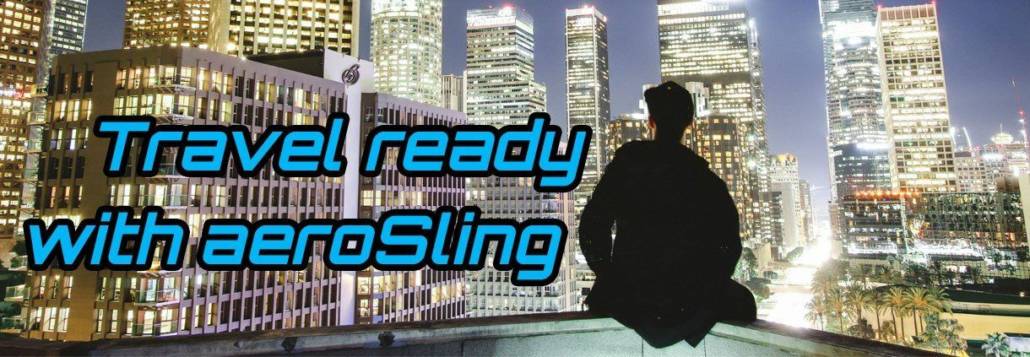 Man overlooking city skyline with “Travel ready with aeroSling” text.